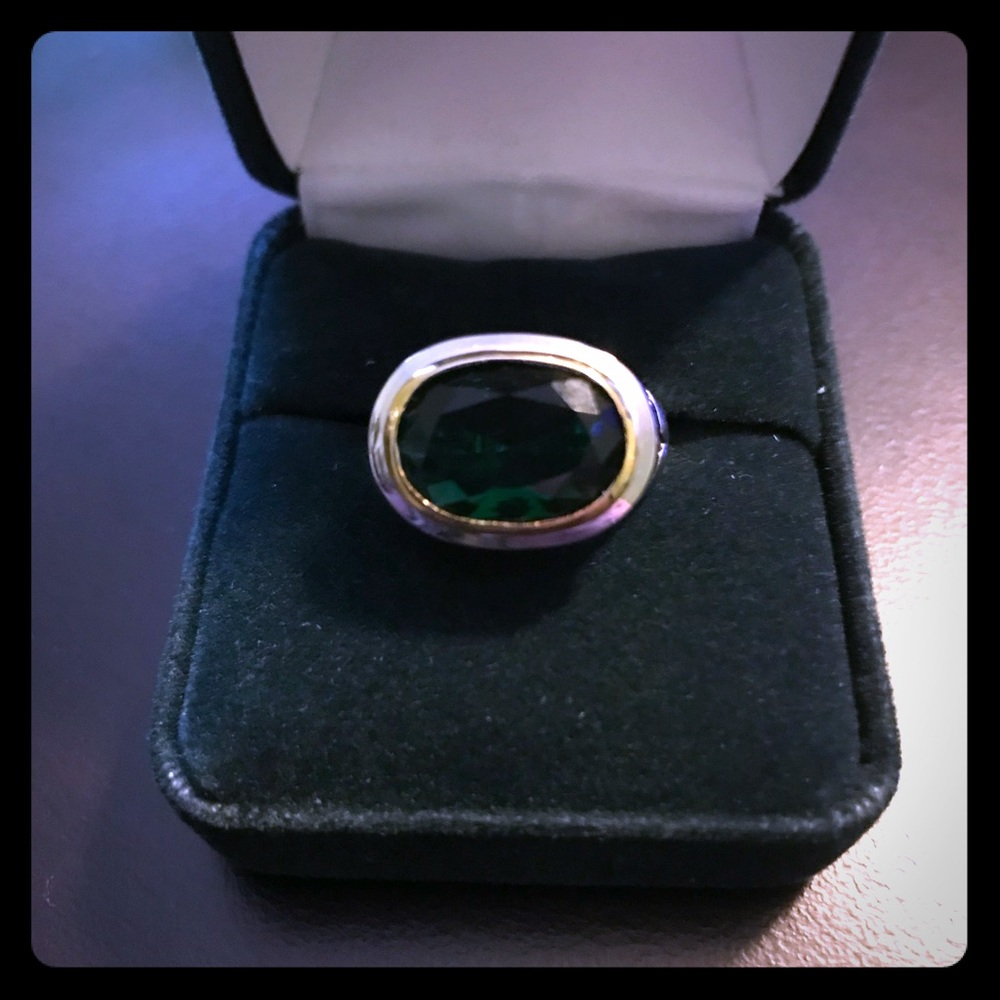 Green stone ring with gold and silver toned band